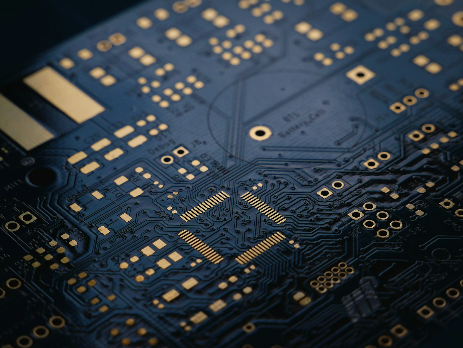 A dark blue circuit board, close up