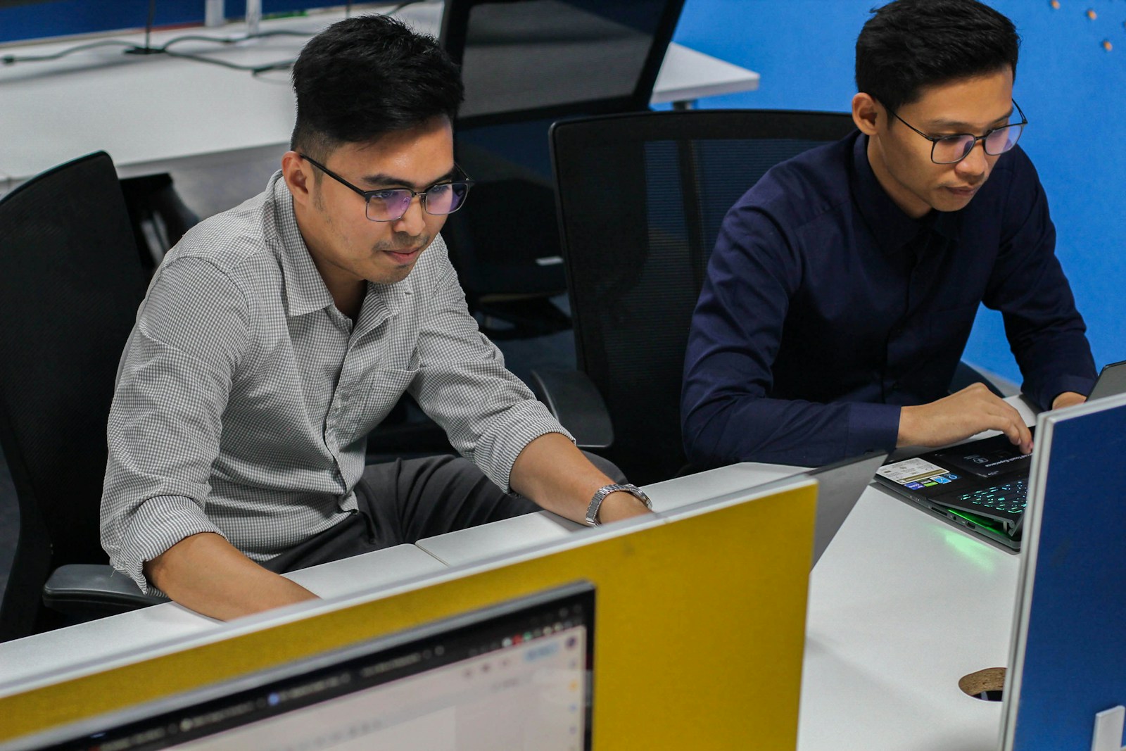 Two engineers working side by side