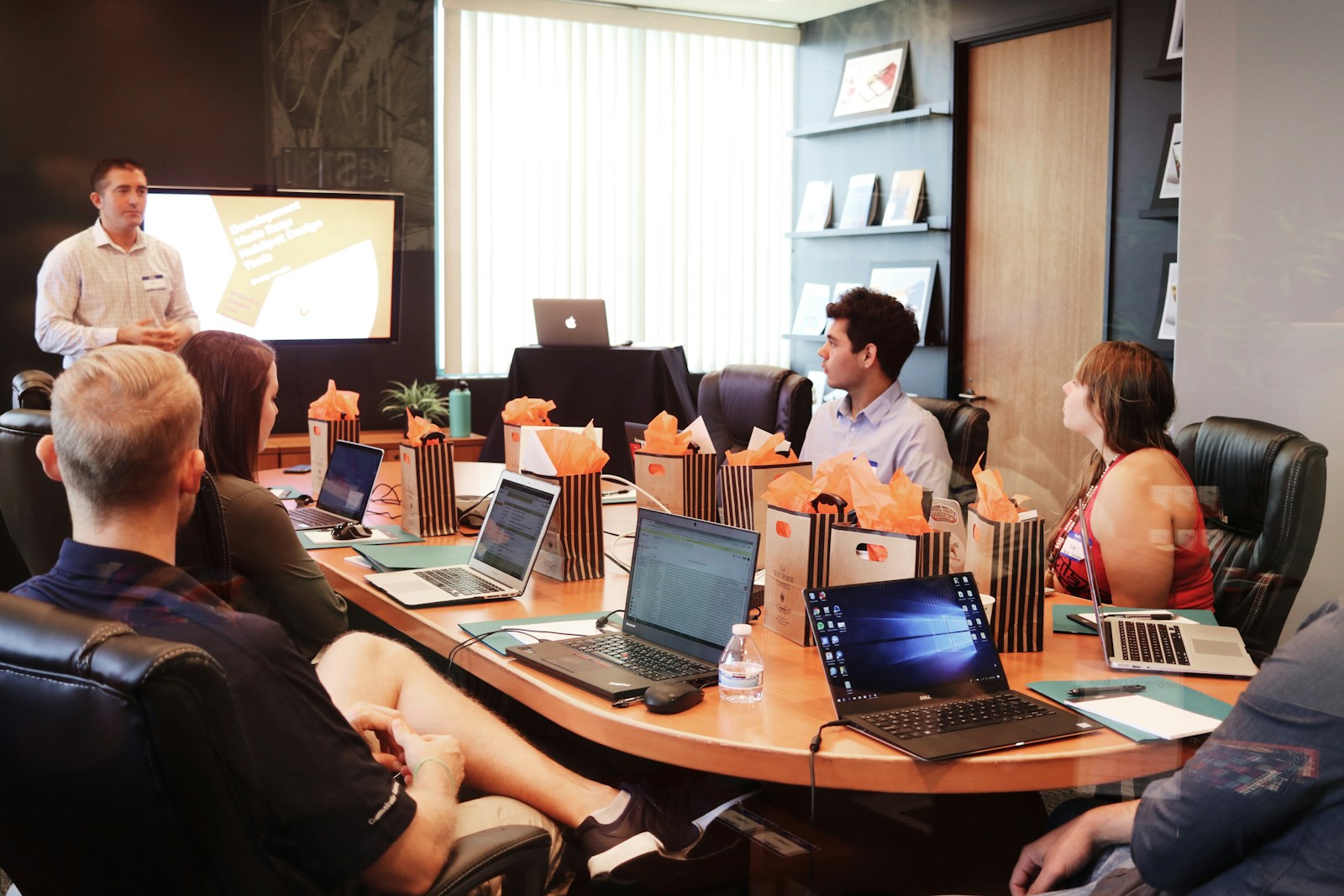 A strategy session, one person presenting to the executive team
